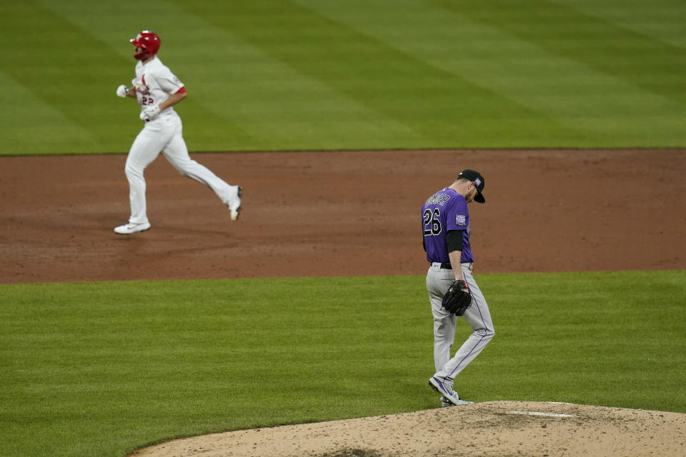 Colorado Rockies starting pitcher Austin Gomber (26) walks around the mound as St. Louis Cardinals' Jack Flaherty rounds the bases after hitting a solo home run during the third inning of a baseball game Friday, May 7, 2021, in St. Louis. (AP Photo/Jeff Roberson)