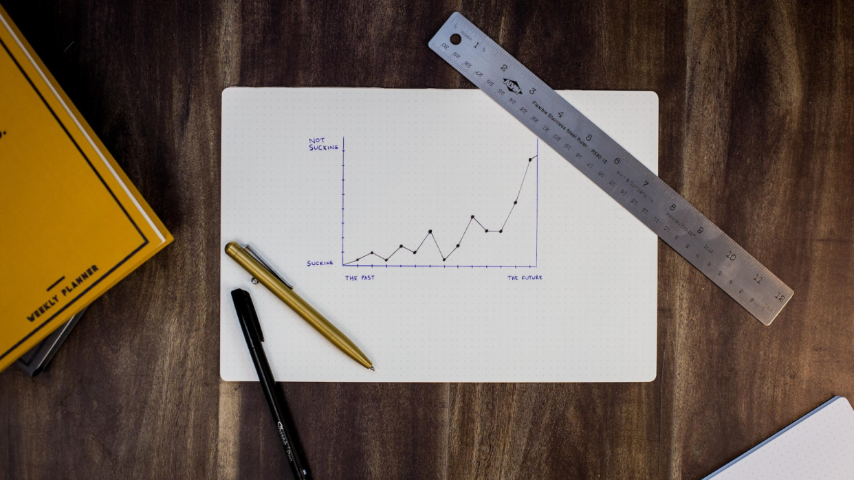  Data drawn on a chart with a ruler and pencil on either side 