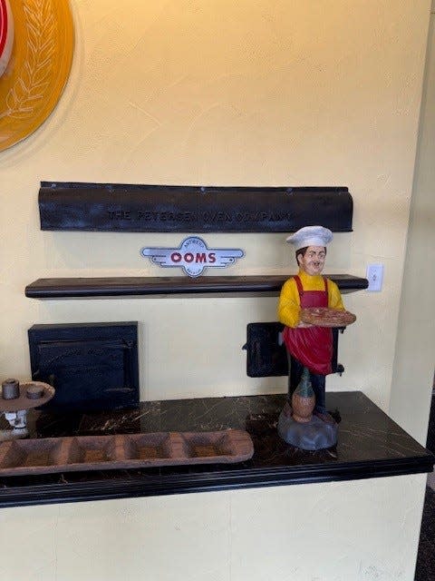 The display in the entryway to the DeIorio's offices contains a piece of the original oven.