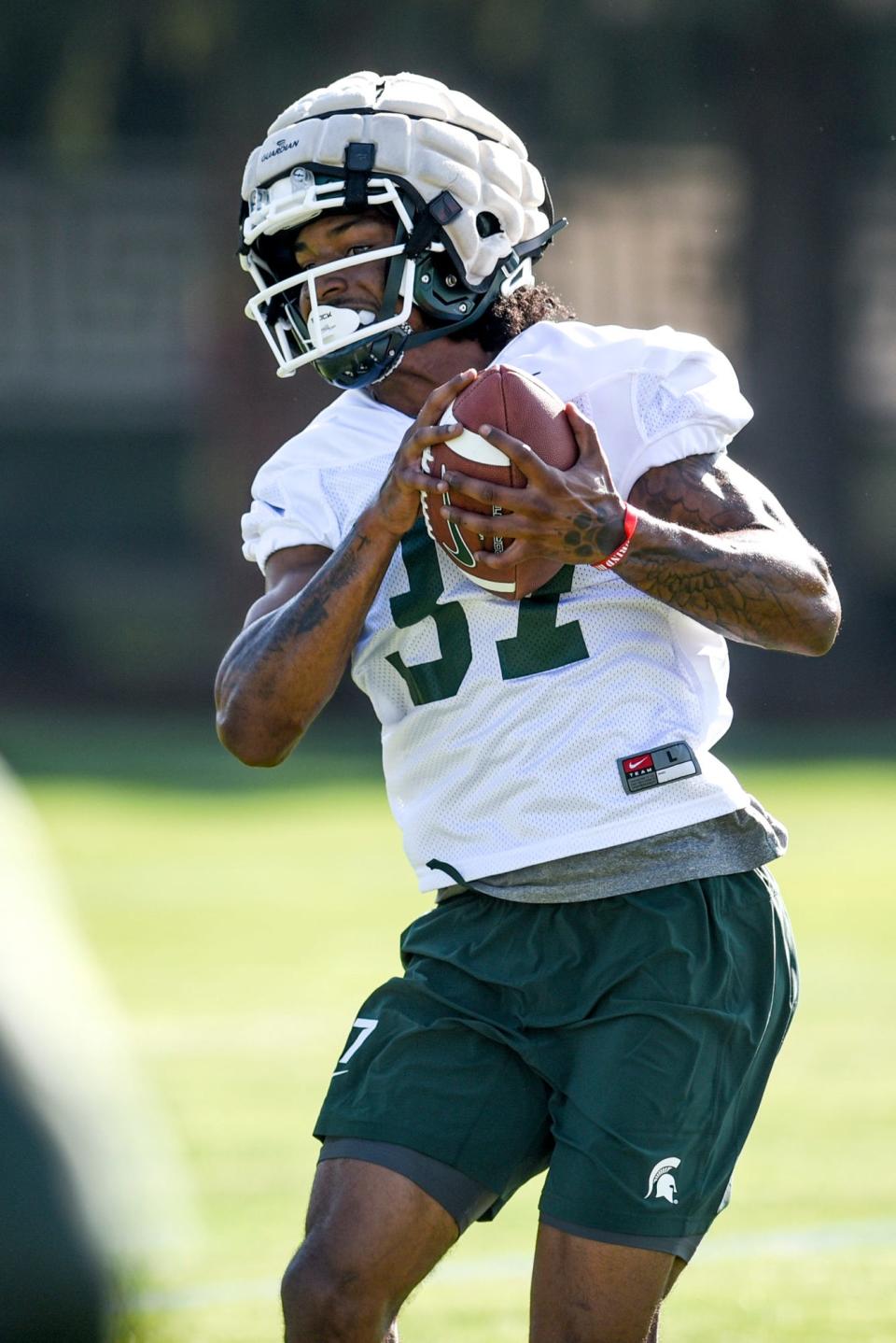Michigan State's defensive back Khary Crump catches the ball during the opening day of MSU's football fall camp on Thursday, Aug. 3, 2023, in East Lansing.