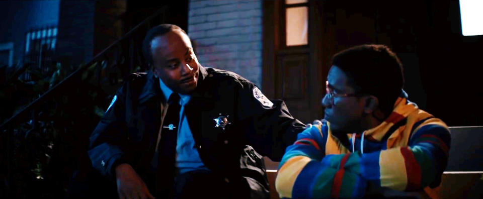 Carl Winslow (Kenan Thompson) comforts Steve Urkel (Chris Redd) after catching him in the midst of an assault. (Saturday Night Live on NBC)