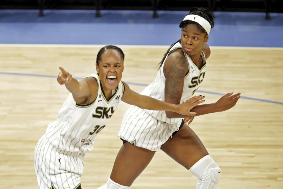 Chicago Sky's Azurá Stevens (30) and Ruthy Hebard, right, celebrate a basket by their teammate Allie Quigley during a WNBA basketball game against the Connecticut Sun, Saturday, June 19, 2021, in Chicago. (AP Photo/Eileen T. Meslar)