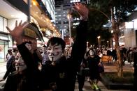 Protesters wearing Guy Fawkes masks attend an anti-government demonstration in Hong Kong