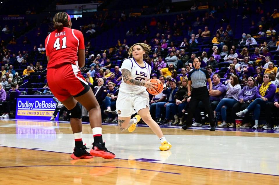 LSU sophomore guard Kateri Poole (55) drives the lane against Lamar inside the Pete Maravich Assembly Center Wednesday, Dec. 14, 2022.