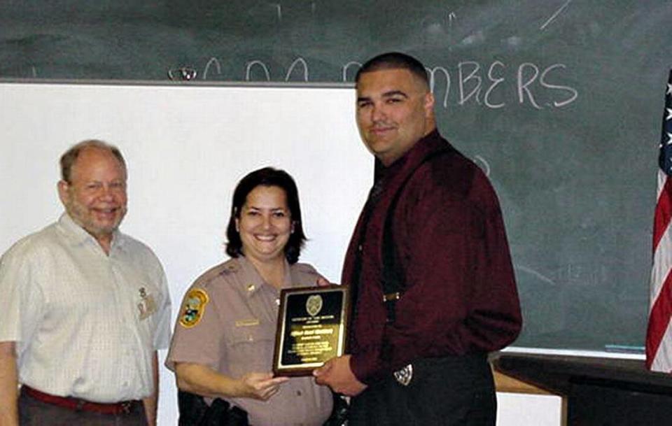 By 2006, Grace O’Donnell, the nation’s first Cuban-American female police officer, had risen to police commander. She’s shown that year with Citizens’ Advisory Committee Chairman Barry White, awarding Officer Raul Martinez the Officer of the Month award. She finished her career as a major in 2010.
