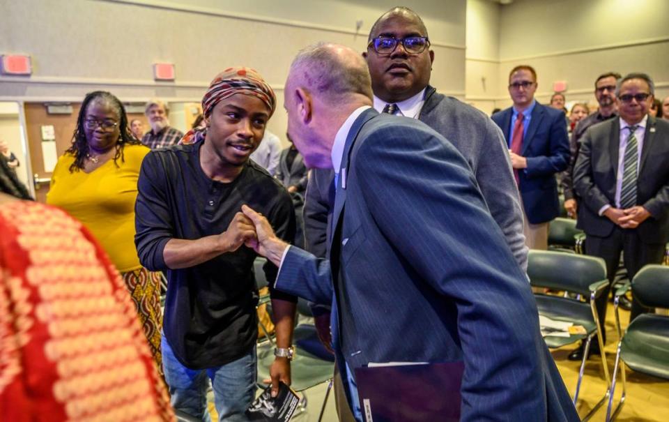 Stevante Clark, whose brother Stephon Clark was killed by Sacramento police officers in 2018, is greeted by Sacramento Mayor Darrell Steinberg before his State of the City address on Feb. 19, 2019, at the Sam & Bonnie Pannell Community Center in Sacramento. Hector Amezcua/hamezcua@sacbee.com