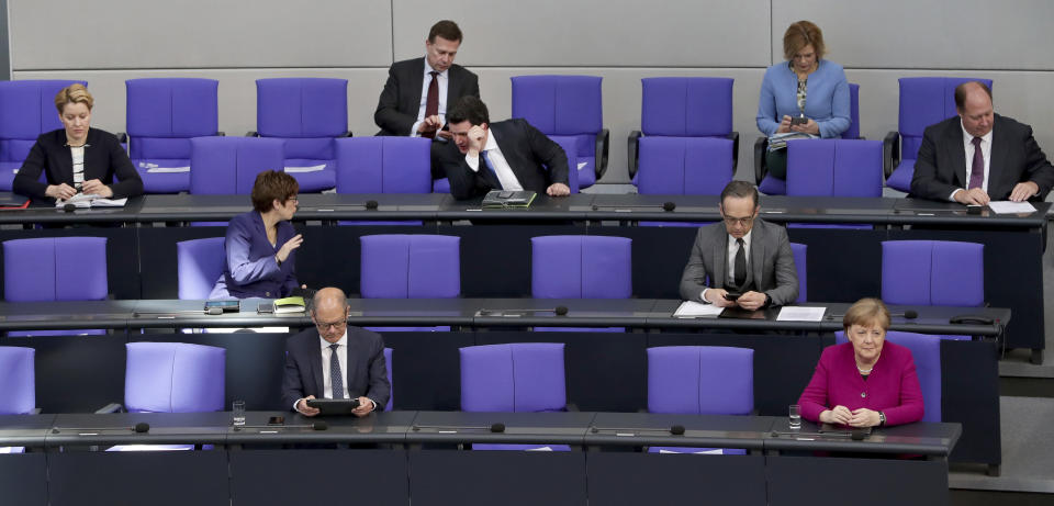 German Chancellor Angela Merkel, front right, and ministers of the German government attend a meeting of the German federal parliament, Bundestag, at the Reichstag building in Berlin, Germany, Thursday, April 23, 2020. (AP Photo/Michael Sohn)