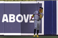 Atlanta Braves right fielder Ronald Acuna Jr. catches a ball hit by Miami Marlins' Vidal Brujan during the fifth inning of a baseball game, Saturday, April 13, 2024, in Miami. (AP Photo/Wilfredo Lee)