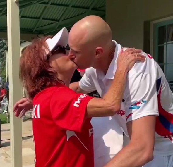 A photo of Lynne McGranger and Ryan 'Fitzy' Fitzgerald kissing at a charity cricket match.