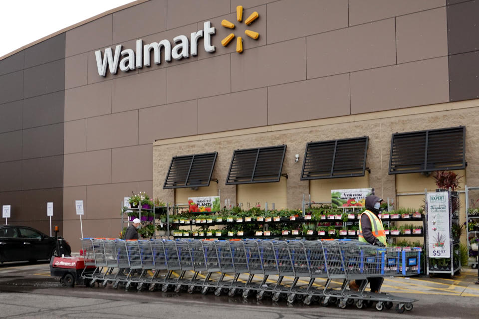 CHICAGO, ILLINOIS - MAY 19: A worker collects shopping carts at a Walmart store on May 19, 2020 in Chicago, Illinois. Walmart reported a 74% increase in U.S. online sales for the quarter that ended April 30, and a 10% increase in same store sales for the same period as the effects of the coronavirus helped to boost sales. (Photo by Scott Olson/Getty Images)