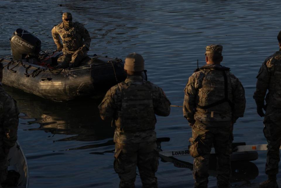 Texas National Guard members load a raft to a pickup at the bank of the Rio Grand at Shelby Park in Eagle Pass, on Jan. 16, 2024. Texas has closed off Shelby Park, cutting access to federal agents to part of the Texas-Mexico border and escalating tensions between the Biden administration and Gov. Greg Abbott.