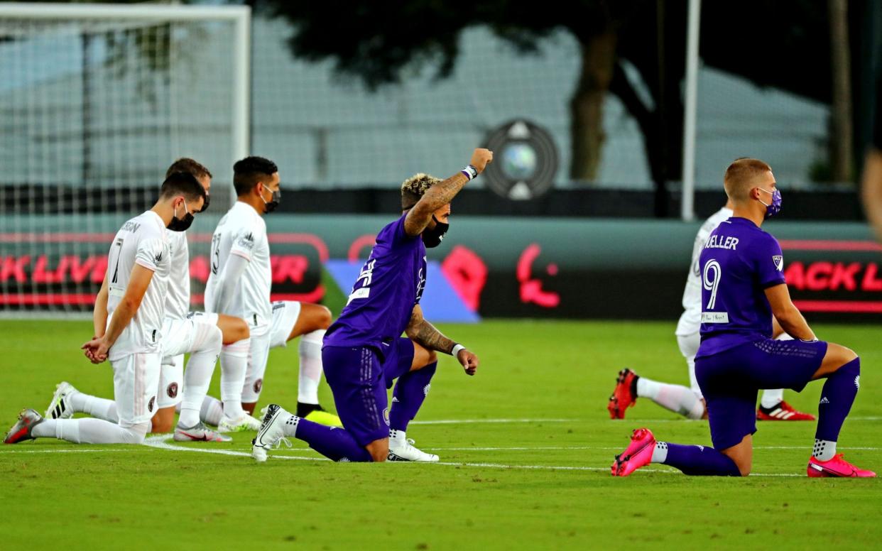 Orlando, FL, Orlando, FL, USA; MLS players participate in a pre game ceremony to support equal rights and Black Lives Matter before the game between the Inter Miami and the Orlando City at the ESPN Wide World of Sports Complex - MLS returns to action with eight-minute taking of the knee - USA TODAY SPORTS