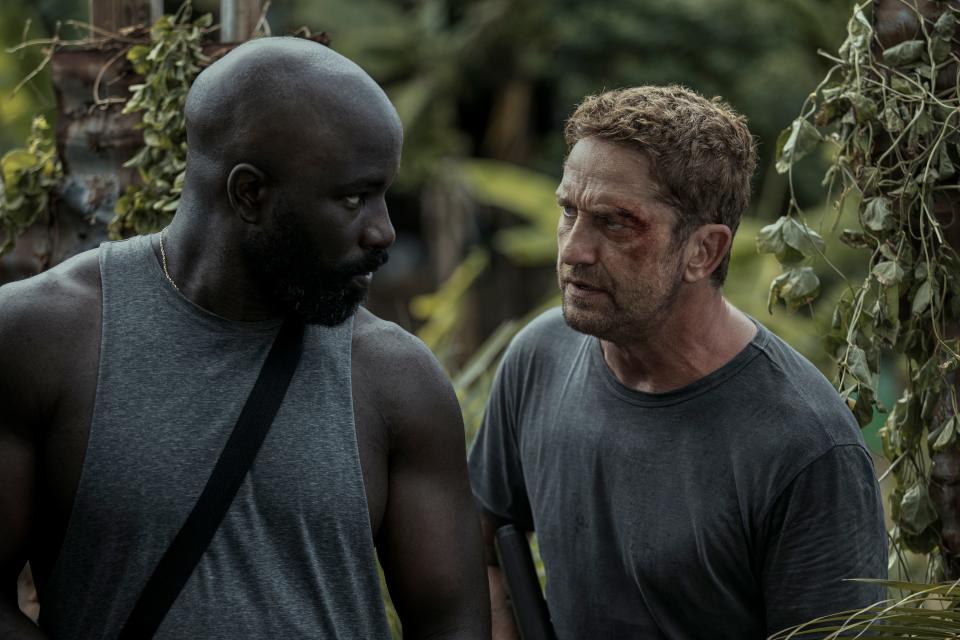 A commercial flight goes down in the Philippines and the pilot (Gerard Butler, right) has to partner with an accused murderer (Mike Colter) on board for extradition to help save survivors after they're taken hostage in "Plane."
