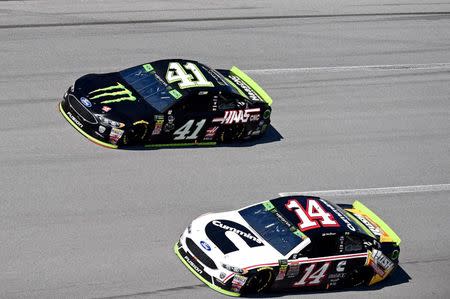 Oct 14, 2018; Talladega, AL, USA; NASCAR Cup Series driver Kurt Busch (41) and NASCAR Cup Series driver Clint Bowyer (14) during the 1000Bulbs.com at Talladega Superspeedway. Mandatory Credit: Adam Hagy-USA TODAY Sports