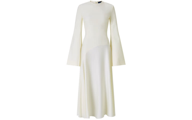 <p>A drop waist, silk skirt and trumpet sleeves is the sartorial recipe for wedding dress success. Team with strappy shoes and a vintage veil. <em><a rel="nofollow noopener" href="https://www.solacelondon.com/gaia-dress-cream-7604.html" target="_blank" data-ylk="slk:Shop now;elm:context_link;itc:0;sec:content-canvas" class="link ">Shop now</a>.</em> </p>