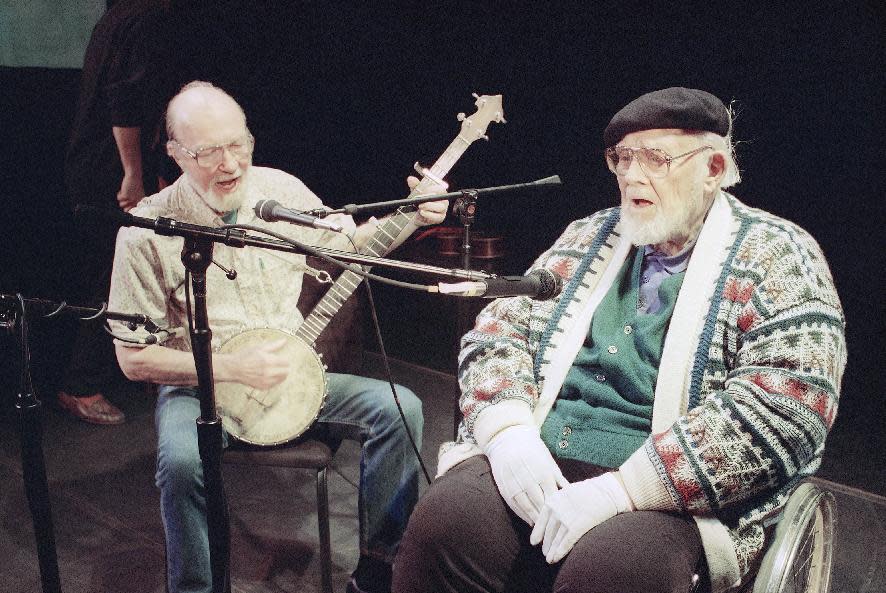 File-This May 1993 file photo shows Pete Seeger, left, age 74, who hadn't sung with Burl Ives, right, age 84, for at least 40 years, singing together in rehearsal at New York's 92nd St., Y. The American troubadour, folk singer and activist Seeger died Monday Jan. 27, 2014, at age 94. (AP Photo/Marty Reichenthal, File)