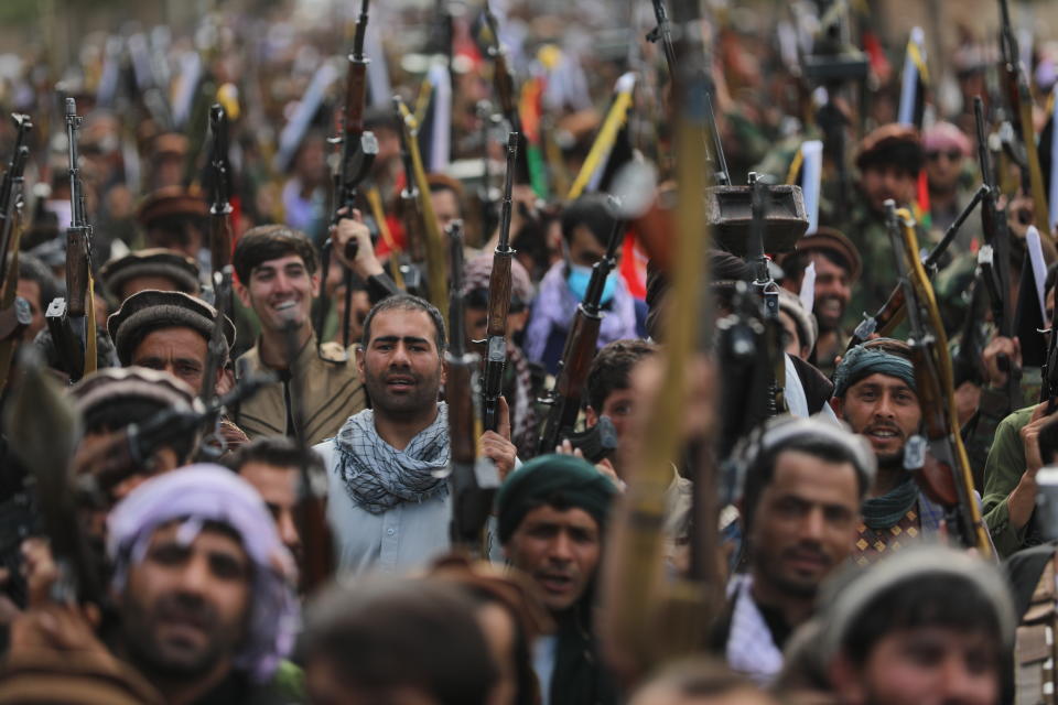 Afghan militiamen join Afghan defense and security forces during a gathering in Kabul, Afghanistan, Wednesday, June 23, 2021. Taliban gains in north Afghanistan, the traditional stronghold of the country's minority ethnic groups who drove the insurgent force from power nearly 20 years ago, has driven a worried government to resurrect militias whose histories have been characterized by chaos and widespread killing. (AP Photo/Rahmat Gul)