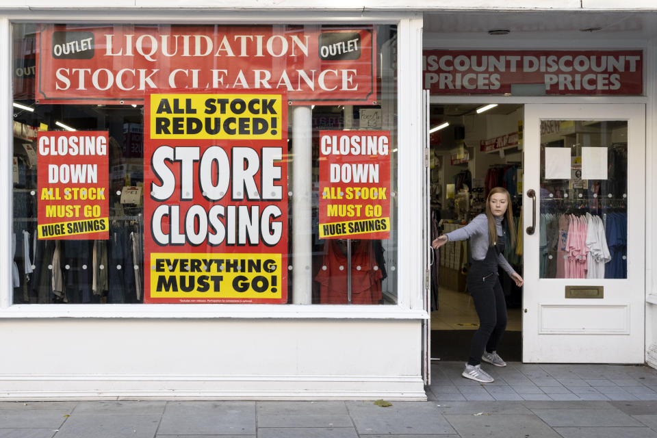 NEWPORT, WALES - SEPTEMBER 14: A shop worker closes the door of a shop that is shutting down on September 14, 2020 in Newport, Wales. First Minister of Wales Mark Drakeford has announced people in Wales must wear face mask in shops and other indoor public spaces from Monday. Indoor meetings of more than six from an extended household will be illegal from Monday. The rule will not apply to children under 11 and up to 30 people from different homes can still meet outside. (Photo by Matthew Horwood/Getty Images)