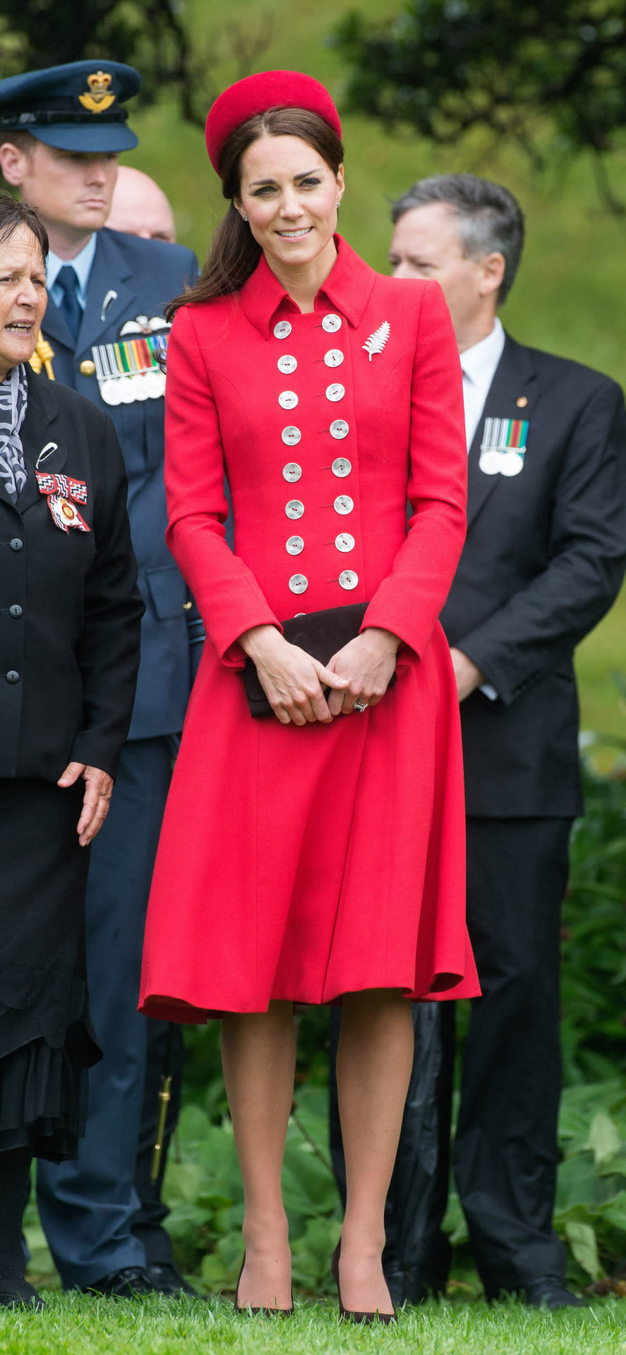 <p>Kate, William and Prince George are welcome into New Zealand with Kate wearing a rich red ensemble by royal favourite, Catherine Walker. The Duchess also wore a matching pillbox hat from Gina Foster.</p><p><i>[Photo: PA]</i></p>