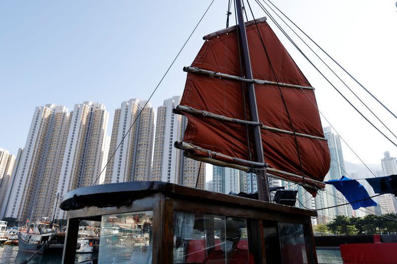Sailing on traditional wooden tourist junk boat "Dukling" in Hong Kong