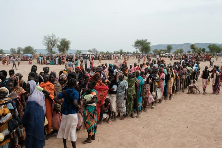 People line up to register for potential food aid delivery at a camp for internally displaced persons in Agari, South Kordofan, on June 17, 2024 (GUY PETERSON)