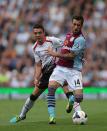 Liverpool's Iago Aspas (left) and Aston Villa's Antonio Luna (right) battle for the ball