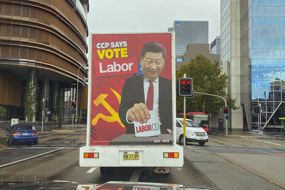 A truck sponsored by conservative lobby group Advance Australia displaying an image of Chinese President Xi Jinping casting a vote for the Australian opposition Labor Party drives down a local street, Saturday, April 9, 2022, in the Parramatta area of Sydney. Australia's Defense Minister Peter Dutton says there is evidence that the Chinese Communist Party wants Australia's government to change at the May 21 election because a center-left Labor Party administration would attempt to appease Beijing. (AP Photo)