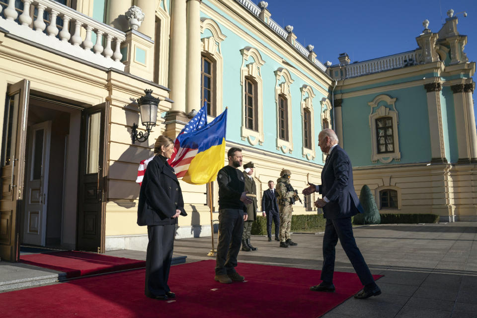 FILE - President Joe Biden, right, meets with Ukrainian President Volodymyr Zelenskyy, center, and Olena Zelenska, left, spouse of President Zelenskyy, at Mariinsky Palace during an unannounced visit in Kyiv, Ukraine, Monday, Feb. 20, 2023. More Americans think foreign policy should be a top focus for the U.S. government in 2024 amid ongoing wars in the Gaza Strip and Ukraine, with a new poll showing overseas concerns and immigration rising in importance, even as they’re overshadowed by long-standing economic worries. (AP Photo/Evan Vucci, Pool, File)