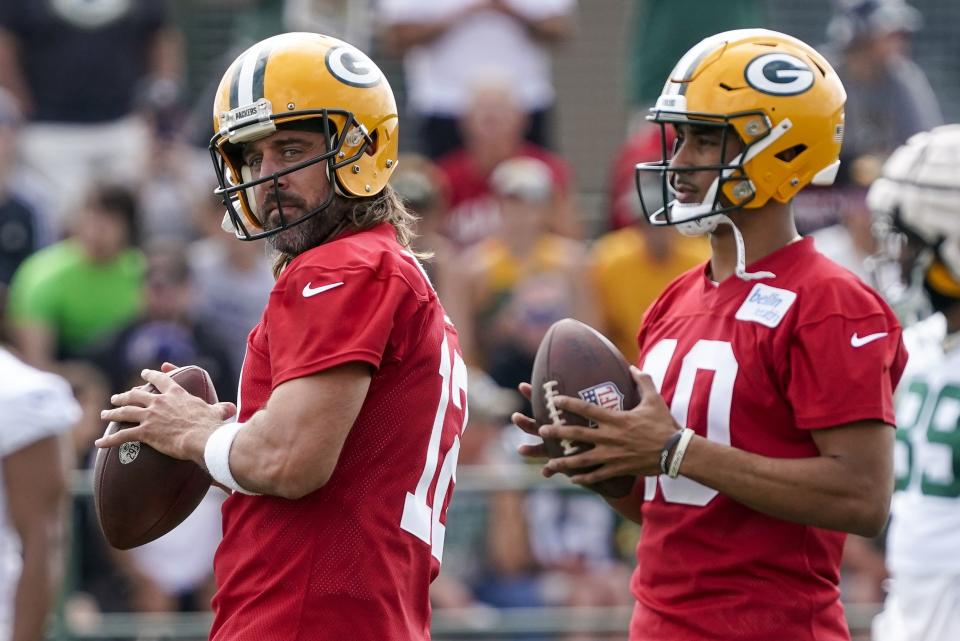 Green Bay Packers’ Aaron Rodgers and <a class="link " href="https://sports.yahoo.com/nfl/players/32696" data-i13n="sec:content-canvas;subsec:anchor_text;elm:context_link" data-ylk="slk:Jordan Love;sec:content-canvas;subsec:anchor_text;elm:context_link;itc:0">Jordan Love</a> run a drill at the NFL football team’s practice field Wednesday, July 27, 2022, in Green Bay, Wis. With Rodgers being traded to the New York Jets, the fourth-year pro Love, a former Utah State star, will finally have his chance to be a starting quarterback. | Morry Gash, Associated Press