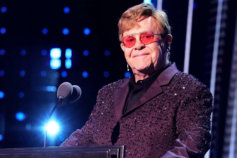 <p>Theo Wargo/Getty</p> Elton John pictured at the 38th Annual Rock & Roll Hall Of Fame Induction Ceremony at Barclays Center in November 2023