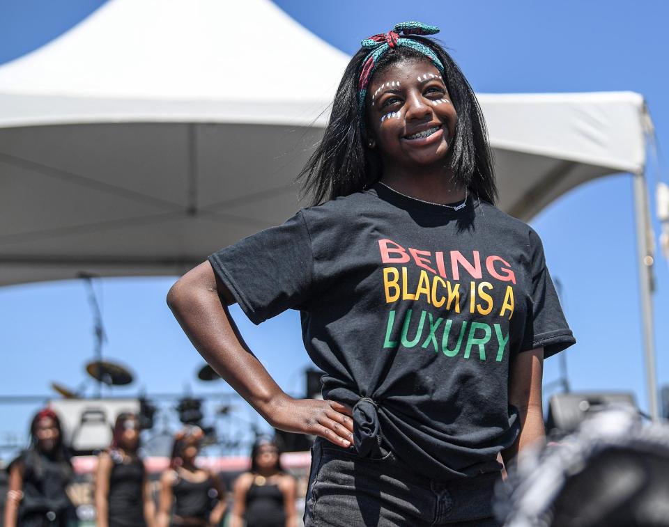 Kanaya Norris takes part in a fashion show and dance with Angel's Elite Model Troupe of Anderson during a Juneteenth event at the Civic Center in Anderson, North Carolina, on June 18, 2022.