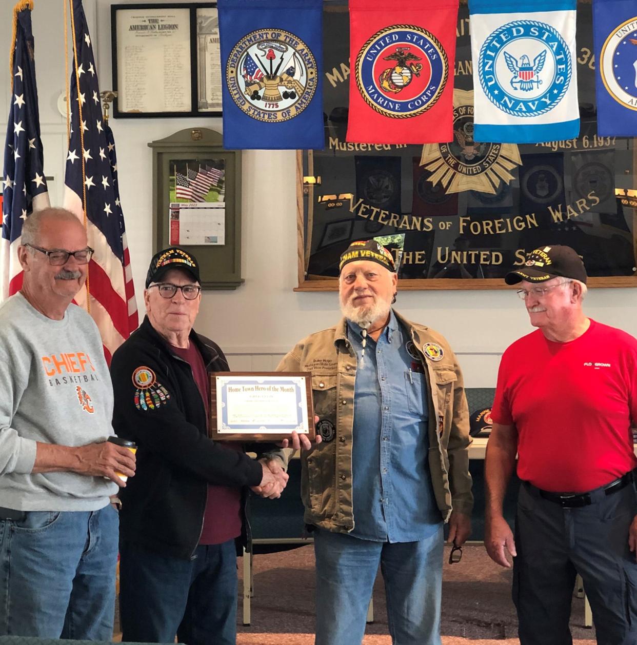 Army veteran Greg Ellis (second from left) was recently named Cheboygan County's Hometown Hero for the month of June.