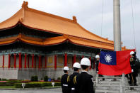 FILE PHOTO: Military honour guards attend a flag-raising ceremony at Chiang Kai-shek Memorial Hall, in Taipei, Taiwan March 16, 2018. REUTERS/Tyrone Siu