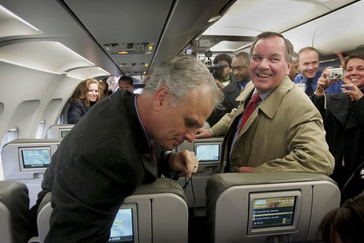 David Neeleman (L), Chairman and CEO of JetBlue Airways, shows Chicago Mayor Richard Daley (R) some of the features of a JetBlue aircraft at O'Hare Airport October 26, 2006 in Chicago, Illinois. (Photo by Scott Olson/Getty Images)