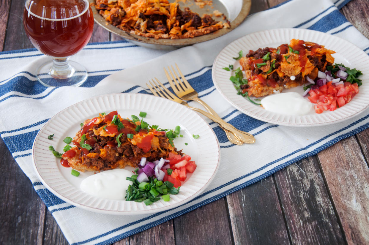 Dorito pie, a cousin to the walking taco and Frito pie, is made with seasoned taco meat and shredded cheese. (Photo: Ben Myhre, Ramshackle Pantry)