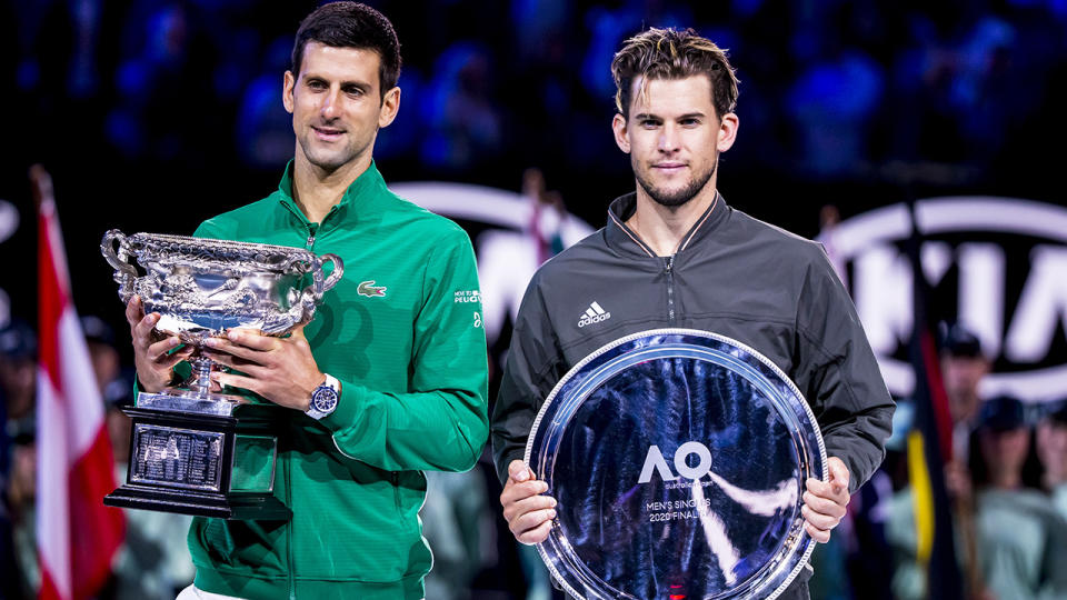 Dominic Thiem is pictured to the right of Novak Djokovic, who he was runner-up to at the 2020 Australian Open.