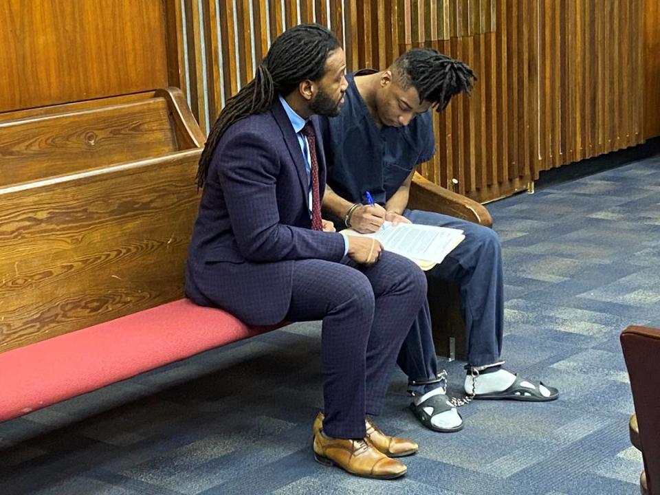 Defense attorney William Kendrick, left, sits with client Marquavious Ford in court after Ford’s guilty plea in his brother’s death.