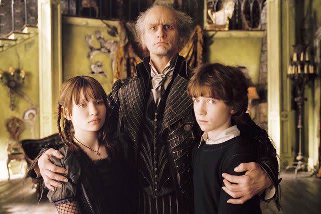 <p>Duhamel/Paramount/Kobal/Shutterstock</p> Emily Browning, Jim Carrey and Liam Aiken in the movie version of 'A Series Of Unfortunate Events'