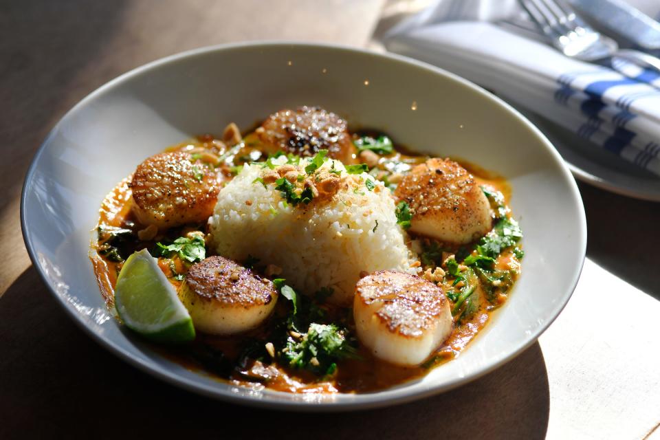 Seared Scallop Coconut Red Curry, one of the house specialties at AB Kitchen, which debuted in January in Atlantic Beach.