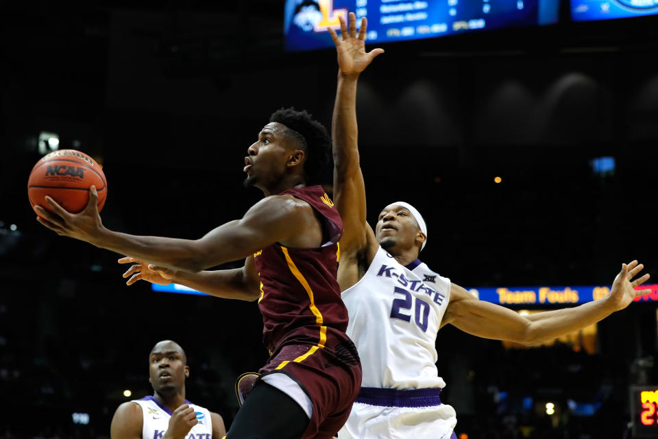 <p>Donte Ingram #0 of the Loyola Ramblers drives to the basket against Xavier Sneed #20 of the Kansas State Wildcats in the second half during the 2018 NCAA Men’s Basketball Tournament South Regional at Philips Arena on March 24, 2018 in Atlanta, Georgia. (Photo by Kevin C. Cox/Getty Images) </p>
