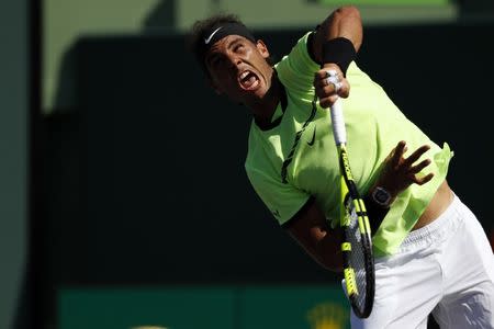 Mar 28, 2017; Miami, FL, USA; Rafael Nadal of Spain serves against Nicolas Mahut of France (not pictured) on day eight of the 2017 Miami Open at Crandon Park Tennis Center. Mandatory Credit: Geoff Burke-USA TODAY Sports