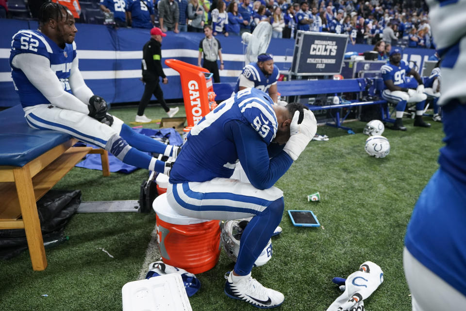 Indianapolis Colts defensive tackle DeForest Buckner (99) and defensive end Samson Ebukam (52) sit on the bench after a loss to the Houston Texans in an NFL football game Saturday, Jan. 6, 2024, in Indianapolis. (AP Photo/Darron Cummings)