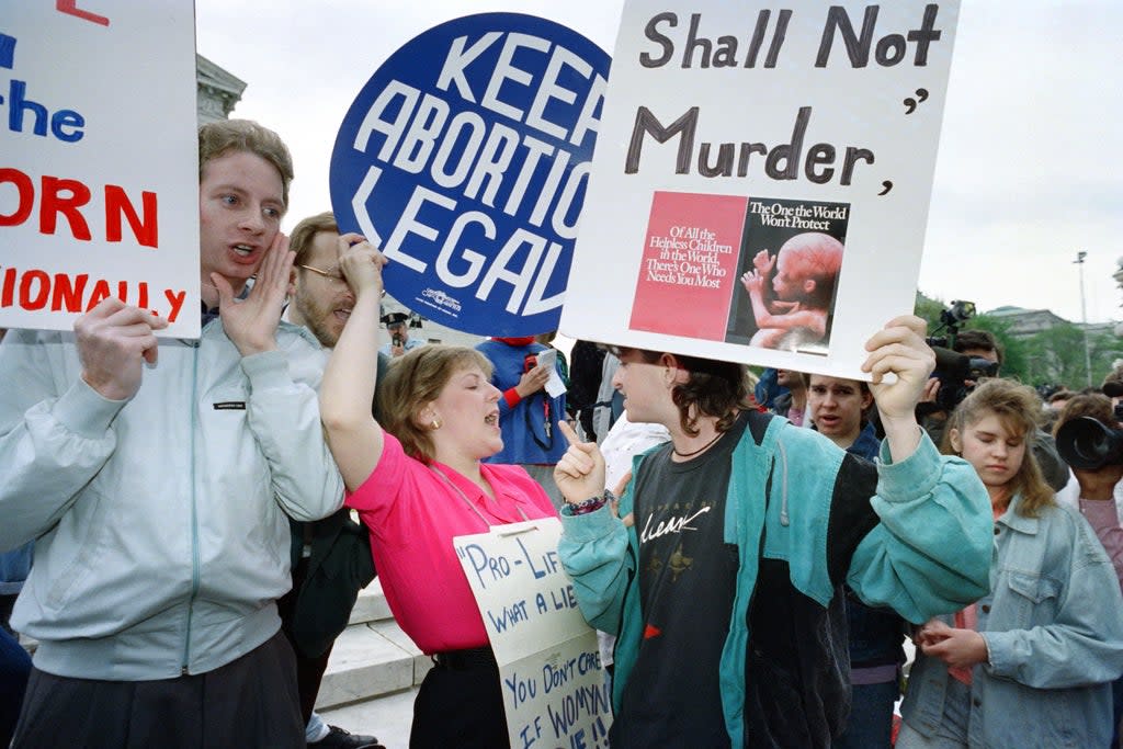 Anti-abortion demonstrations and abortion rights proponents  protest at a protest in 1989.  (AFP via Getty Images)