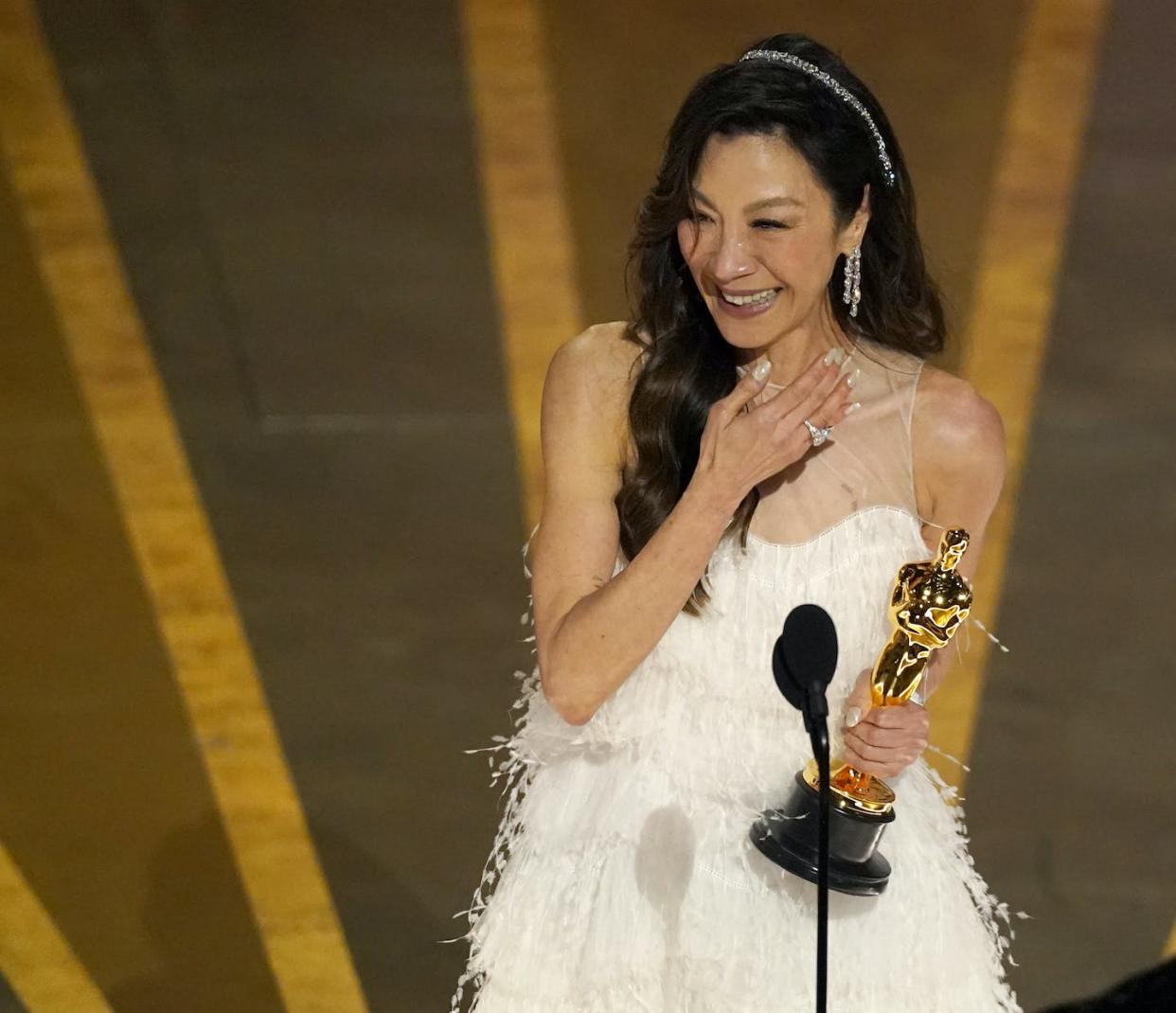 Michelle Yeoh accepts the award for best performance by an actress in a leading role for 'Everything Everywhere All at Once' at the Oscars on March 12, 2023, at the Dolby Theatre in Los Angeles. (AP Photo/Chris Pizzello)