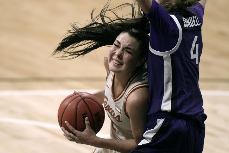 Texas guard Shaylee Gonzales, left, looks to shoot around Kansas State guard Serena Sundell during an NCAA college basketball game in the the Big 12 Conference tournament Friday, March 10, 2023, in Kansas City, Mo. (AP Photo/Charlie Riedel)