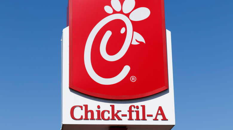 Chick-fil-a sign against sky background