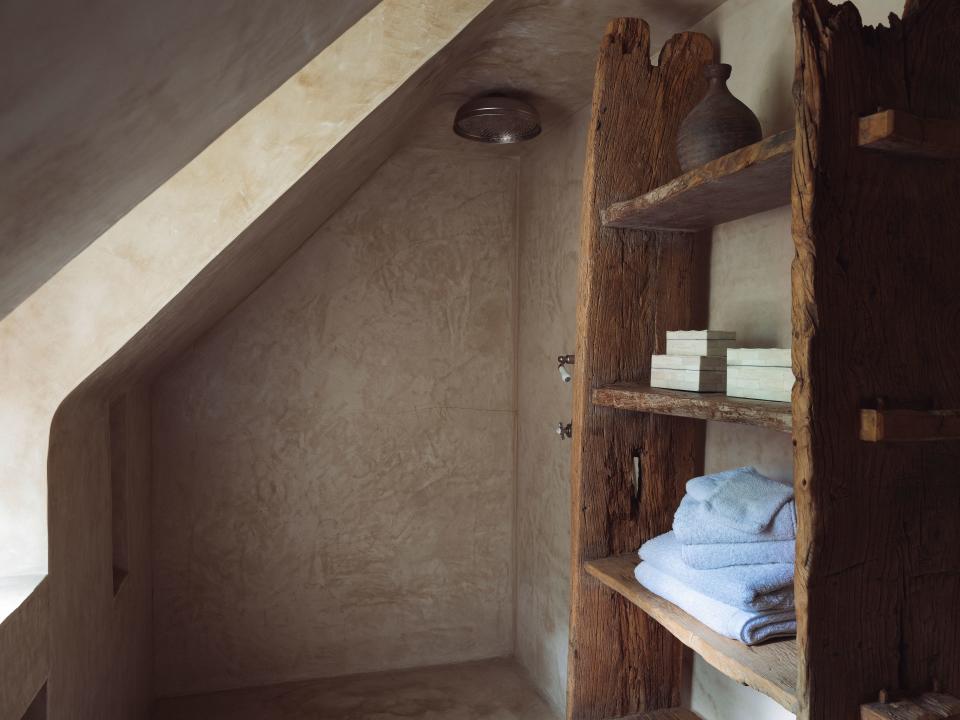 The second-floor guest bath is covered in tadalakt, a waterproof plaster used in Moroccan architecture.