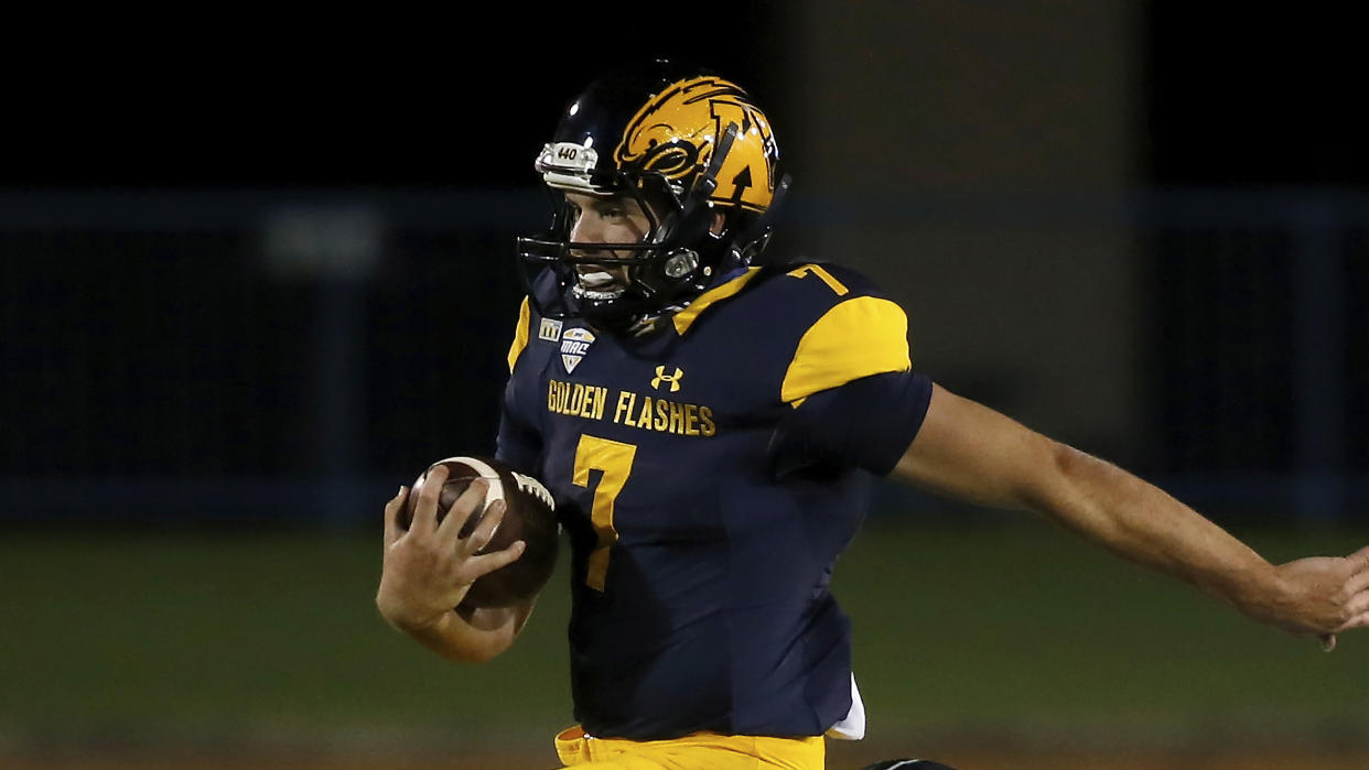 Kent State Golden Flashes quarterback Dustin Crum (7) runs with the ball during an NCAA football game against the Eastern Michigan Eagles on Wednesday, Nov. 4, 2020, in Kent, Ohio. (AP Photo/Kirk Irwin)