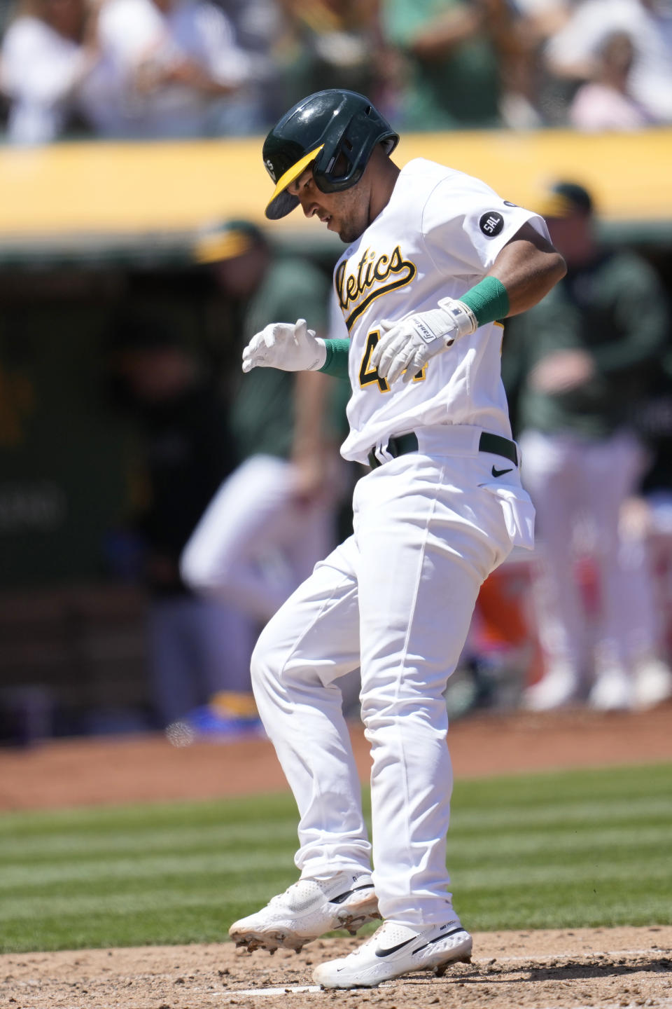 Oakland Athletics' Carlos Perez touches home plate after hitting a home run against the Philadelphia Phillies during the fifth inning of a baseball game in Oakland, Calif., Saturday, June 17, 2023. (AP Photo/Jeff Chiu)