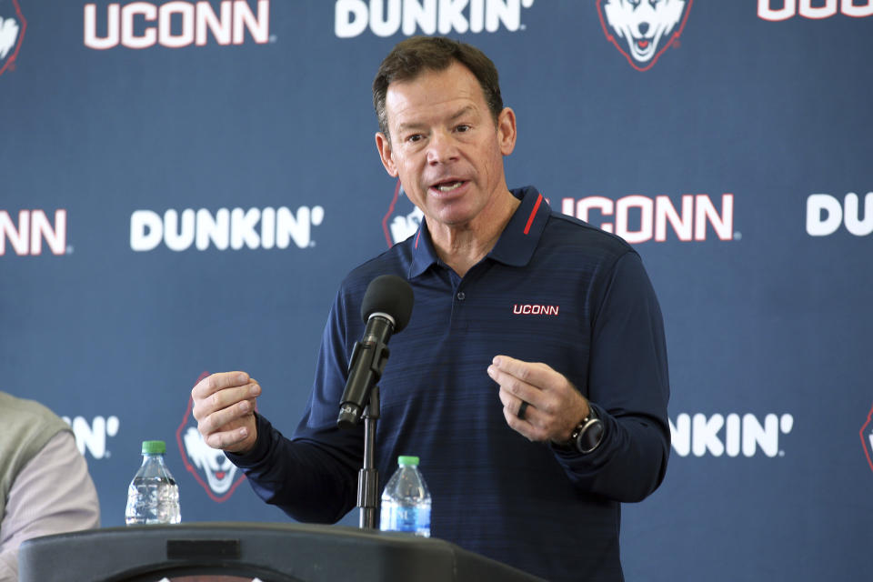 Jim Mora speaks with the media during a press conference announcing him as the new head coach of Connecticut University football, Saturday, Nov. 27, 2021, in East Hartford, Conn. (AP Photo/Stew Milne)